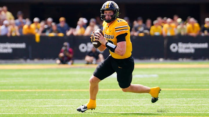 Sep 14, 2024; Columbia, Missouri, USA; Missouri Tigers quarterback Brady Cook (12) drops back to pass against the Boston College Eagles during the first half at Faurot Field at Memorial Stadium. Mandatory Credit: Denny Medley-Imagn Images