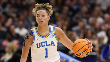 Apr 4, 2025; Tampa, FL, USA;  UCLA Bruins guard Kiki Rice (1) controls the ball against the Connecticut Huskies during first quarter in a semifinal of the women's 2025 NCAA tournament at Amalie Arena. Mandatory Credit: Nathan Ray Seebeck-Imagn Images