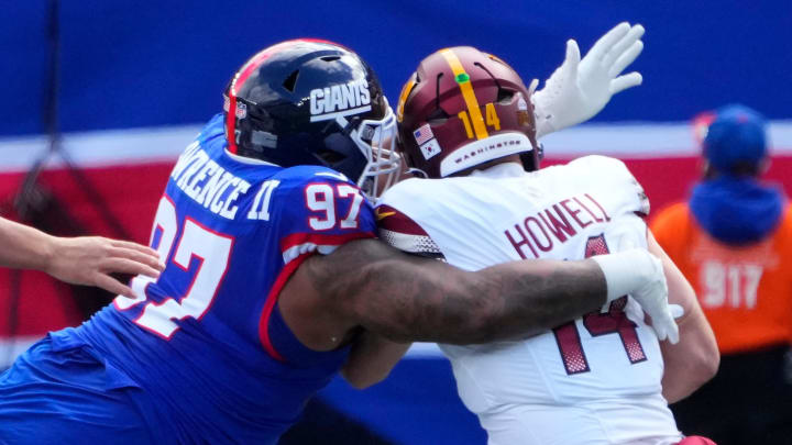 Oct 22, 2023; East Rutherford, New Jersey, USA; New York Giants defensive tackle Dexter Lawrence II (97) sacks Washington Commanders quarterback Sam Howell (14) in the first half  at MetLife Stadium. Mandatory Credit: Robert Deutsch-USA TODAY Sports
