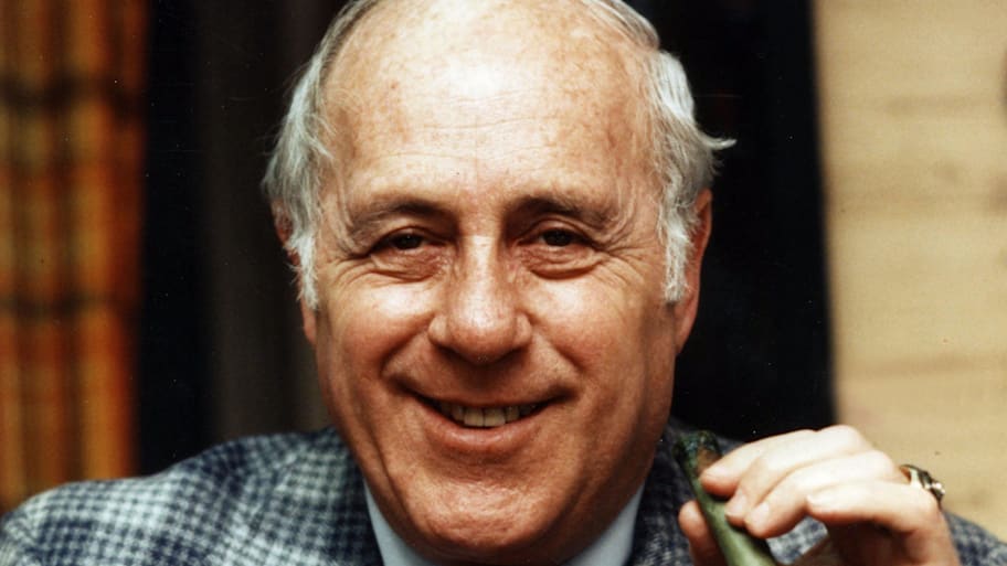 Boston Celtics former head coach Red Auerbach in his office during the mid 1980s.