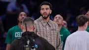 Oct 24, 2025; New York, New York, USA;  Boston Celtics forward Jayson Tatum, center, looks on during the fourth quarter against the New York Knicks at Madison Square Garden. Mandatory Credit: Vincent Carchietta-Imagn Images