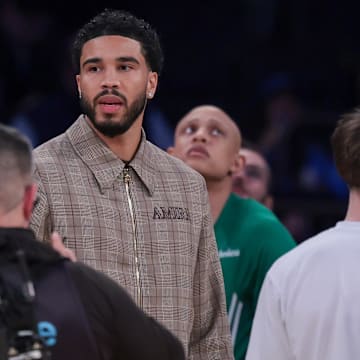 Oct 24, 2025; New York, New York, USA;  Boston Celtics forward Jayson Tatum, center, looks on during the fourth quarter against the New York Knicks at Madison Square Garden. Mandatory Credit: Vincent Carchietta-Imagn Images