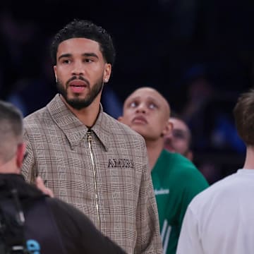 Oct 24, 2025; New York, New York, USA;  Boston Celtics guard Jayson Tatum, center, looks on during the fourth quarter against the New York Knicks at Madison Square Garden. Mandatory Credit: Vincent Carchietta-Imagn Images
