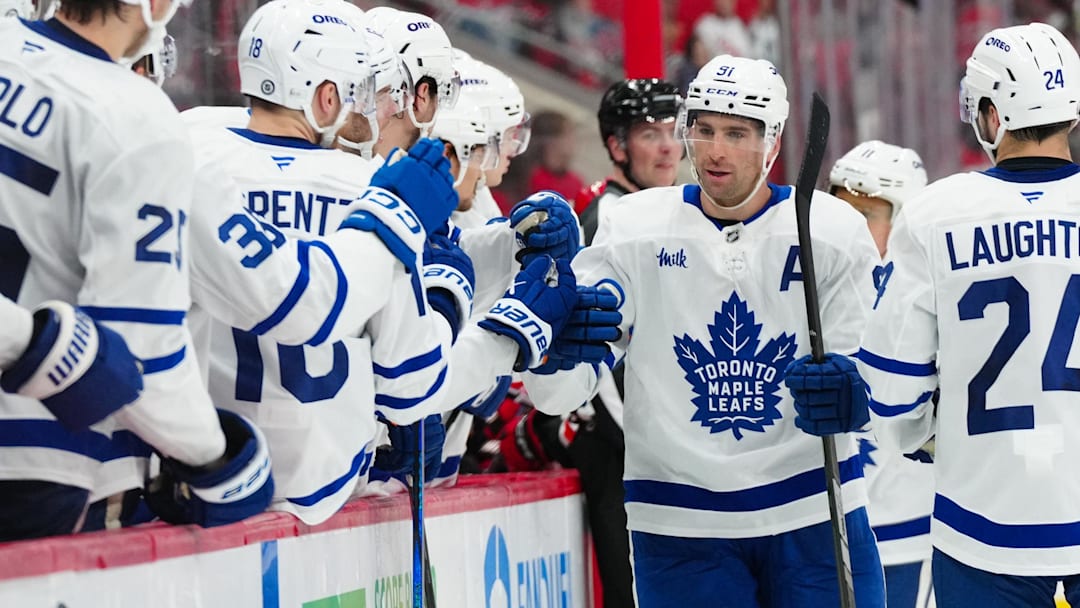 Apr 13, 2025; Raleigh, North Carolina, USA; Toronto Maple Leafs center John Tavares (91) celebrates a goal against the Carolina Hurricanes during the third period at Lenovo Center. Mandatory Credit: James Guillory-Imagn Images