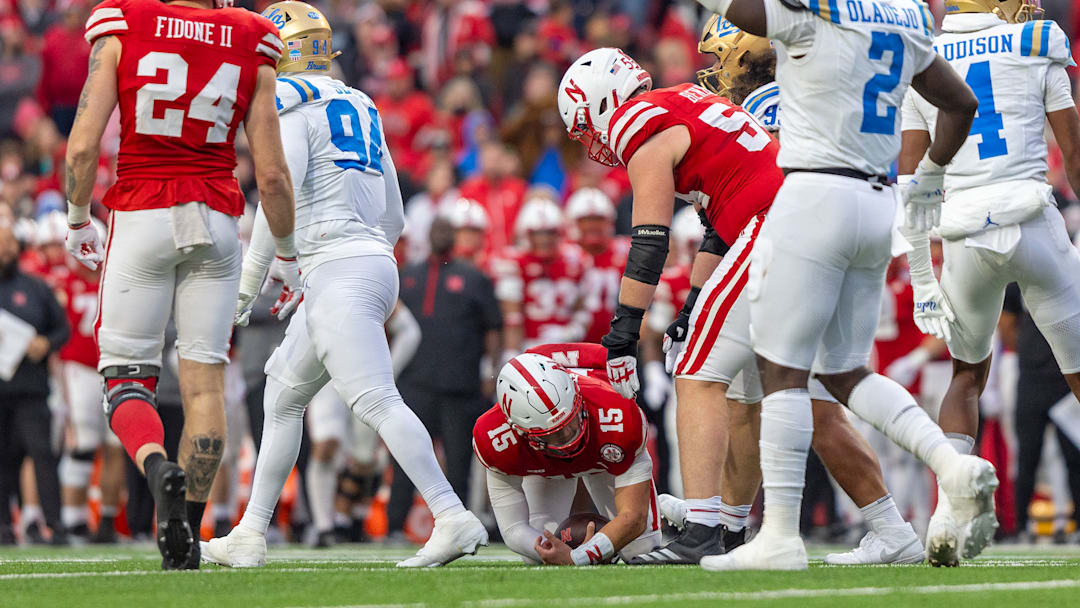 Nebraska quarterback Dylan Raiola is helped up after being sacked by UCLA early in the fourth quarter. He left the game after being injured during the Huskers' next offensive series.