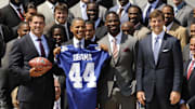 New York Giants 2005 draft picks Chris Snee (left) and Justin Tuck pose with President Barack Obama (middle left) and quarterback Eli Manning (far right) during their visit to the White House following their Super Bowl XLII championship.