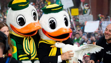 Lee Corso holds a duck alongside The Duck after picking the Ducks as the winner of Saturday's top-10 matchup against the UCLA Bruins on ESPN's College GameDay at the University of Oregon.