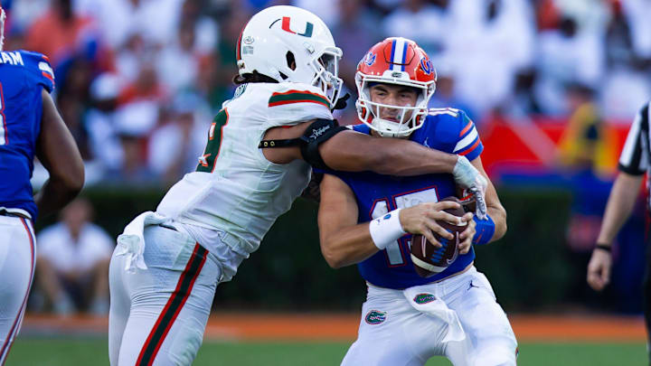 Miami Hurricanes defensive lineman Tyler Baron (9) sacks Florida Gators quarterback Graham Mertz (15) during the season opener at Ben Hill Griffin Stadium in Gainesville, FL on Saturday, August 31, 2024 against the University of Miami Hurricanes in the second half. Miami defeated the Gators 41-17. [Doug Engle/Gainesville Sun]