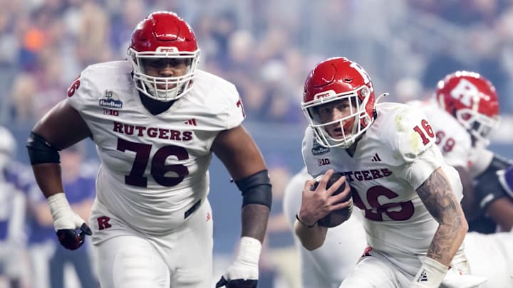 Dec 26, 2024; Phoenix, AZ, USA; Rutgers Scarlet Knights quarterback Athan Kaliakmanis (16) and offensive lineman Dantae Chin (76) against the Kansas State Wildcats during the Rate Bowl at Chase Field. Mandatory Credit: Mark J. Rebilas-Imagn Images Dec 26, 2024; Phoenix, AZ, USA; Rutgers Scarlet Knights quarterback Athan Kaliakmanis (16) and offensive lineman Dantae Chin (76) against the Kansas State Wildcats during the Rate Bowl at Chase Field. Mandatory Credit: Mark J. Rebilas-Imagn Images