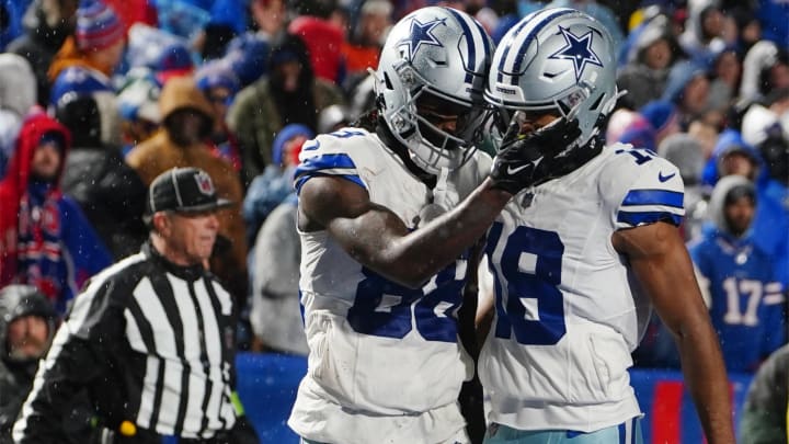 Dec 17, 2023; Orchard Park, New York, USA; Dallas Cowboys wide receiver CeeDee Lamb (88) celebrates a touchdown with Dallas Cowboys wide receiver Jalen Tolbert (18) in the second half against the Buffalo Bills at Highmark Stadium. 