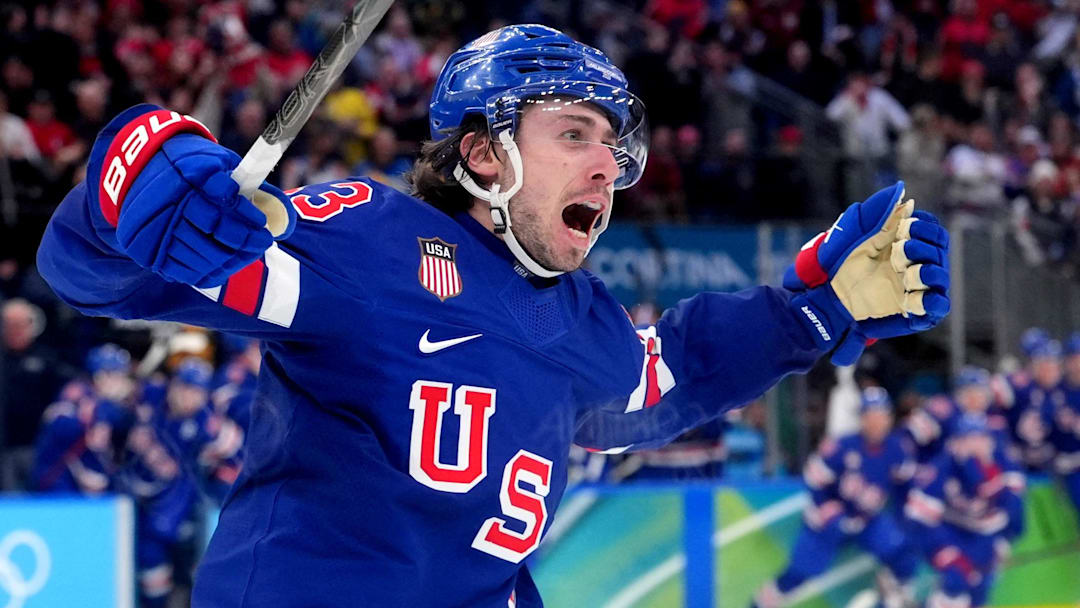 Feb 18, 2026; Milan, Italy; Quinn Hughes (43) of the United States celebrates his winning goal in overtime against Sweden in a men's ice hockey quarterfinal during the Milano Cortina 2026 Olympic Winter Games at Milano Santagiulia Ice Hockey Arena. Mandatory Credit: Amber Searls-Imagn Images