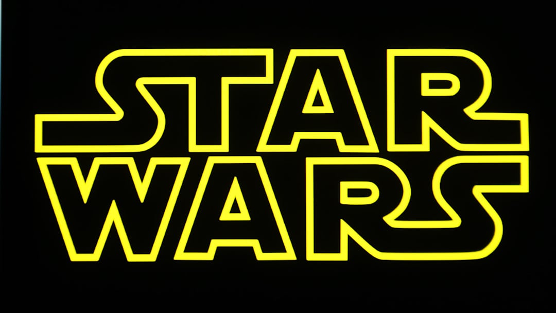 In this photo illustration, a Star Wars logo is seen on a...