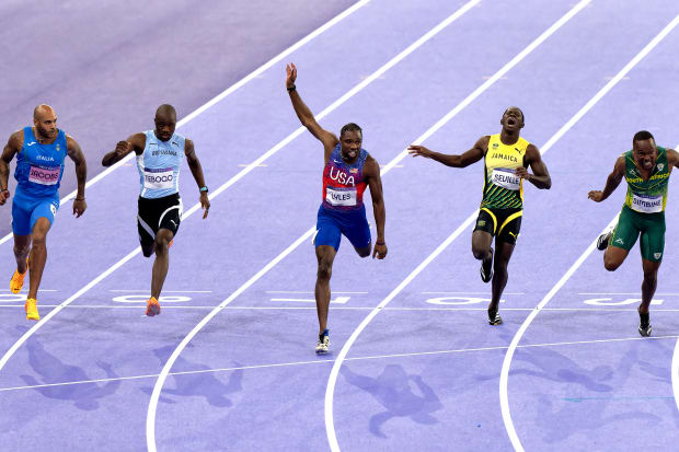 The title of world's fastest man came down to a photo finish.