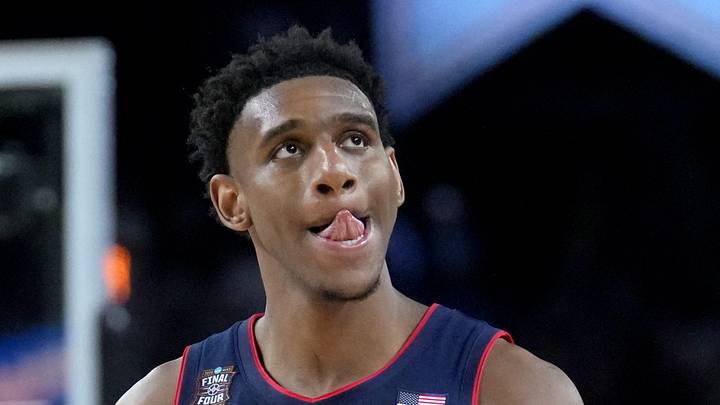 UConn Huskies forward Tarris Reed Jr. (5) walks off the court as time ticks off the clock Monday, April 6, 2026, during the NCAA men’s basketball national championship game against the Michigan Wolverines at Lucas Oil Stadium in Indianapolis.