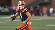 Aug 29, 2025; Champaign, Illinois, USA;  Illinois Fighting Illini quarterback Luke Altmyer (9) runs the ball against the Western Illinois Leathernecks during the first half at Memorial Stadium. Mandatory Credit: Ron Johnson-Imagn Images