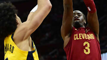 Apr 2, 2023; Cleveland, Ohio, USA; Cleveland Cavaliers guard Caris LeVert (3) shoots over the defense of  Indiana Pacers guard Andrew Nembhard (2) during the second half at Rocket Mortgage FieldHouse. Mandatory Credit: Ken Blaze-Imagn Images