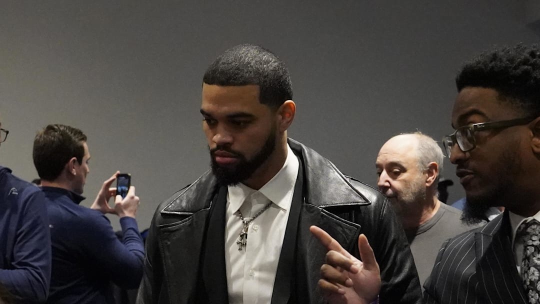 Chicago Bears quarterback Caleb Williams arrives at a press conference introducing new head coach Ben Johnson.