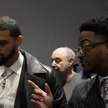 Chicago Bears quarterback Caleb Williams arrives at a press conference introducing new head coach Ben Johnson.