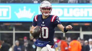 Dec 28, 2024; Foxborough, Massachusetts, USA; New England Patriots quarterack Drake Maye (10) rolls out to throw the ball against the Los Angeles Chargers during the second half at Gillette Stadium. Mandatory Credit: Gregory Fisher-Imagn Images