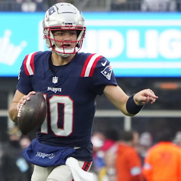 Dec 28, 2024; Foxborough, Massachusetts, USA; New England Patriots quarterack Drake Maye (10) rolls out to throw the ball against the Los Angeles Chargers during the second half at Gillette Stadium. Mandatory Credit: Gregory Fisher-Imagn Images
