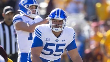 Nov 23, 2024; Tempe, Arizona, USA; Brigham Young Cougars offensive lineman Austin Leausa (55) against the Arizona State Sun Devils at Mountain America Stadium. Mandatory Credit: Mark J. Rebilas-Imagn Images