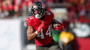 Jan 5, 2025; Tampa, Florida, USA; Tampa Bay Buccaneers running back Sean Tucker (44) runs with the ball against the New Orleans Saints in the fourth quarter  at Raymond James Stadium. 