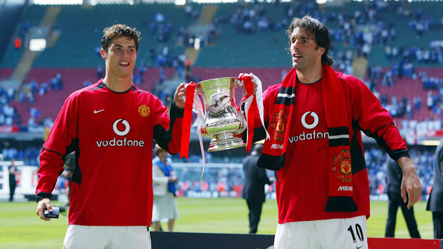 Cristiano Ronaldo and Ruud van Nistelrooy lift the FA Cup in 2004.