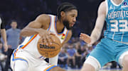 Oklahoma City Thunder guard Isaiah Joe (11) drives down the court beside Charlotte Hornets forward Liam McNeeley (33) during the second quarter of a game between the Charlotte Hornets and the Oklahoma City Thunder at Paycom Center.