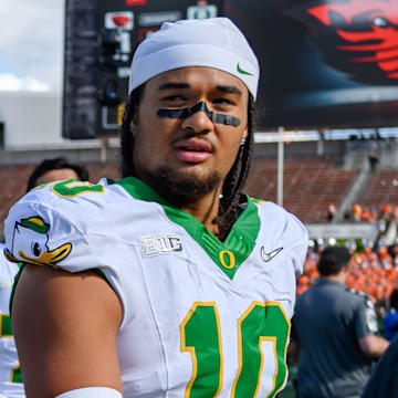 Sep 14, 2024; Corvallis, Oregon, USA; Oregon Ducks offensive lineman Iapani Laloulu (72) and Oregon Ducks defensive end Matayo Uiagalelei (10) leave the field after the game against the Oregon State Beavers at Reser Stadium. Mandatory Credit: Craig Strobeck-Imagn Images