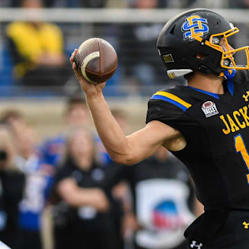 SDSU's Mark Gronowski (11) throws ball at the beginning of a play against the Montana State Bobcats at Dana J. Dykhouse Stadium in Brookings, South Dakota on Saturday, Sept. 9, 2023.