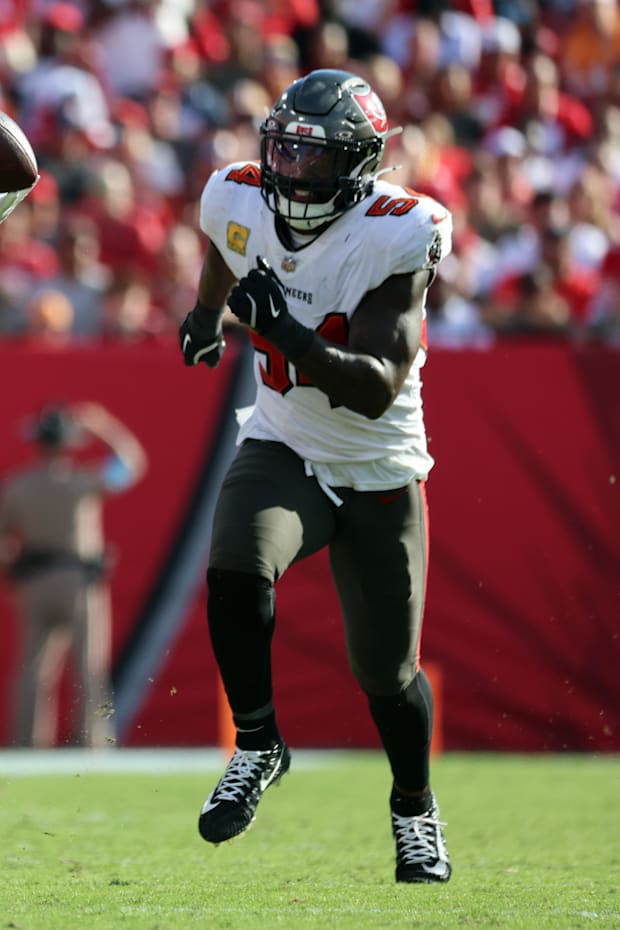 San Francisco 49ers running back Christian McCaffrey catches the ball over Tampa Bay Buccaneers linebacker Lavonte David. 