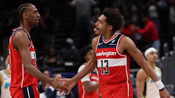 Feb 12, 2025; Washington, District of Columbia, USA; Washington Wizards guard Jordan Poole (13) celebrates with Wizards forward Alex Sarr (20) after making a game-tying basket against the Indiana Pacers in the final seconds of the fourth quarter at Capital One Arena. Mandatory Credit: Geoff Burke-Imagn Images