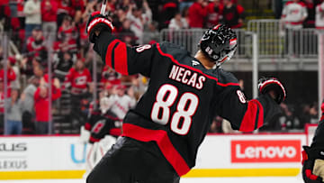 Nov 5, 2024; Raleigh, North Carolina, USA;  Carolina Hurricanes center Martin Necas (88) scores the game-winner against the Philadelphia Flyers during the third period at Lenovo Center. Mandatory Credit: James Guillory-Imagn Images