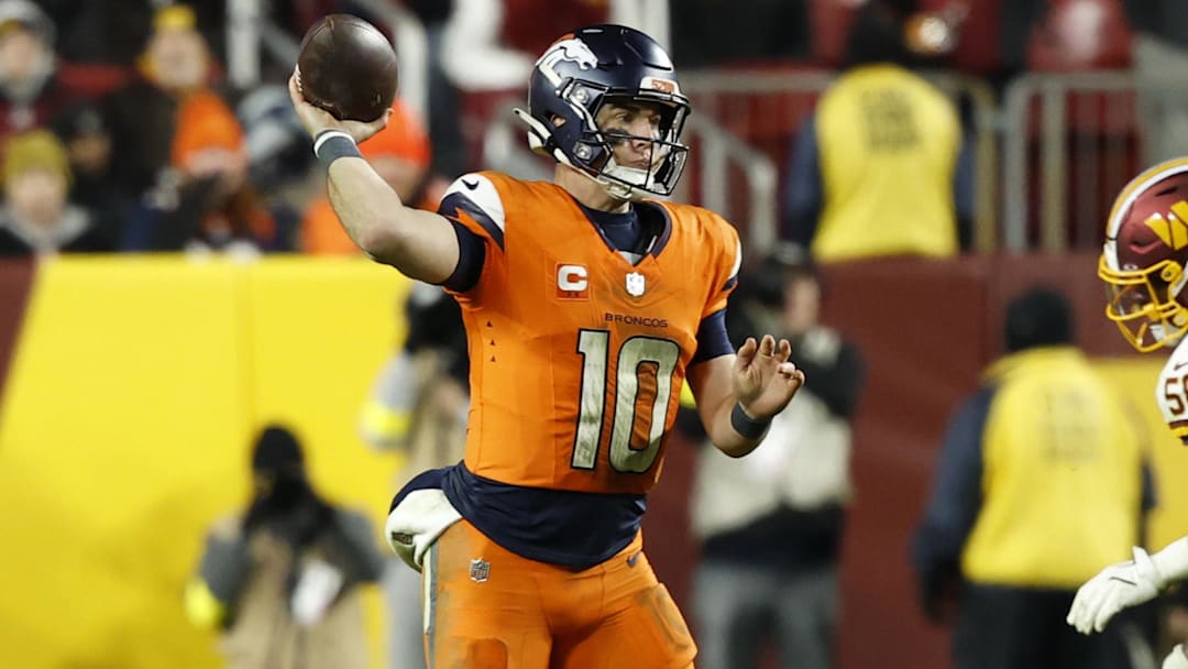 Nov 30, 2025; Landover, Maryland, USA; Denver Broncos quarterback Bo Nix (10) passes the ball against the Washington Commanders during overtime at Northwest Stadium. Nov 30, 2025; Landover, Maryland, USA; Denver Broncos quarterback Bo Nix (10) passes the ball against the Washington Commanders during overtime at Northwest Stadium.