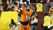Nov 30, 2025; Landover, Maryland, USA;  Denver Broncos quarterback Bo Nix (10) passes the ball against the Washington Commanders during overtime at Northwest Stadium. 