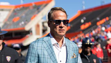 Nov 23, 2024; Gainesville, Florida, USA; Mississippi Rebels head coach Lane Kiffin walks off the field before a game against the Florida Gators at Ben Hill Griffin Stadium.