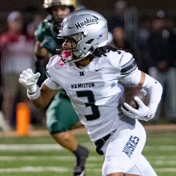 Hamilton's Roye Oliver III (3) runs with the ball against Basha during their high-profile Arizona matchup Friday night.
