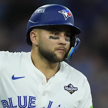 Nov 1, 2025; Toronto, Ontario, CAN; Toronto Blue Jays designated hitter Bo Bichette (11) runs after hitting a three run home run against the Los Angeles Dodgers in the third inning during game seven of the 2025 MLB World Series at Rogers Centre.