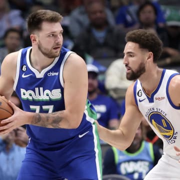 Nov 29, 2022; Dallas, Texas, USA;  Dallas Mavericks guard Luka Doncic (77) controls the ball as Golden State Warriors guard Klay Thompson (11) defends during the first quarter at American Airlines Center. Mandatory Credit: Kevin Jairaj-USA TODAY Sports