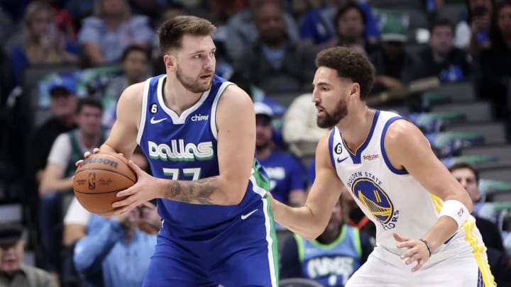 Nov 29, 2022; Dallas, Texas, USA;  Dallas Mavericks guard Luka Doncic (77) controls the ball as Golden State Warriors guard Klay Thompson (11) defends during the first quarter at American Airlines Center. Mandatory Credit: Kevin Jairaj-USA TODAY Sports