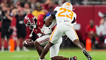 Alabama wide receiver Lotzeir Brooks (17) drops a pass while defended by Tennessee defensive back Boo Carter (23) during a college football game between Tennessee and Alabama at Bryant-Denny Stadium in Tuscaloosa, Ala., on Oct. 18, 2025.