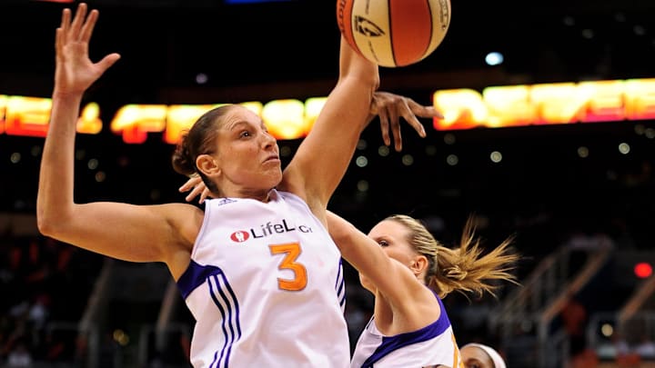 Sep 17 2011; Phoenix, AZ, USA; Phoenix Mercury guard Diana Taurasi (3) and teammate forward Penny Taylor (13) jump for the ball while playing against the Seattle Storm during the second half at the US Airways Center.  The Mercury defeated the Storm 92 - 83. Mandatory Credit: Jennifer Stewart-Imagn Images