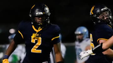 Regina’s Savion Miller (2) runs back to the sidelines after scoring against Northeast during a Class 1A playoff game Oct. 24, 2025 in Iowa City, Iowa.