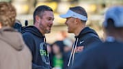 Oregon head coach Dan Lanning, left, and USC head coach Lincoln Riley shake hands before the game as the Oregon Ducks host the USC Trojans on Nov. 22, 2025, at Autzen Stadium in Eugene, Oregon.