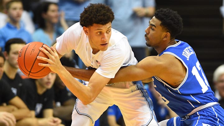 Mar 4, 2017; Chapel Hill, NC, USA; North Carolina Tar Heels forward Justin Jackson (44) with the ball as Duke Blue Devils guard Matt Jones (13) defends.
