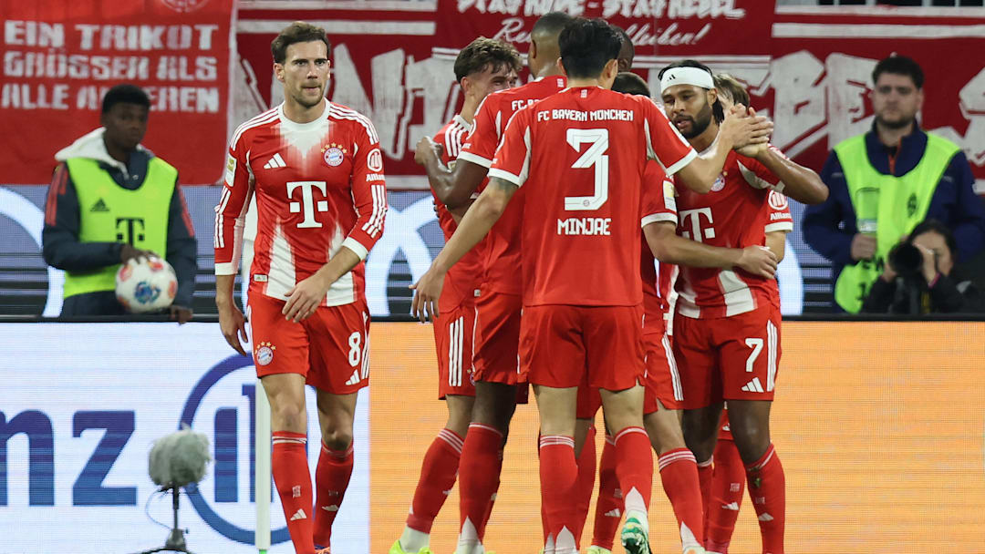 Bayern Munich players celebrating Serge Gnabry's goal against Bayer Leverkusen.