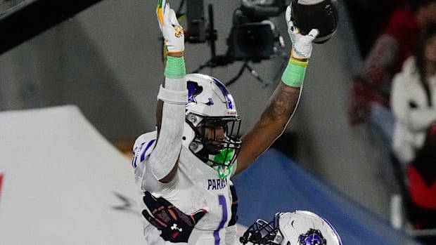 Dec 6, 2024; Birmingham, AL, USA; Parker's Kameron Scarver (56) lifts Parker's Na'eem Offord (1) in celebration after Offord 