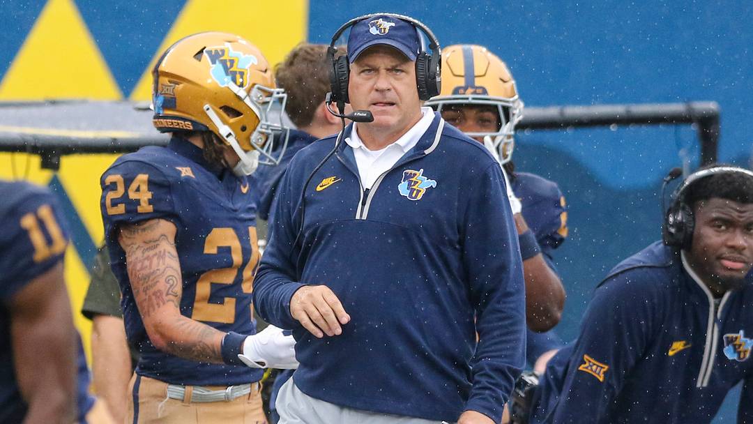 Sep 27, 2025; Morgantown, West Virginia, USA; West Virginia Mountaineers head coach Rich Rodriguez watches a play during the first quarter against the Utah Utes at Milan Puskar Stadium. Mandatory Credit: Ben Queen-Imagn Images