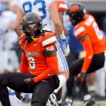 Oklahoma State's Trey Rucker (9) celebrates a play in the first half of the college football game between the Oklahoma State University Cowboys and the Brigham Young Cougars at Boone Pickens Stadium in Stillwater, Okla., Saturday, Nov. 25, 2023.