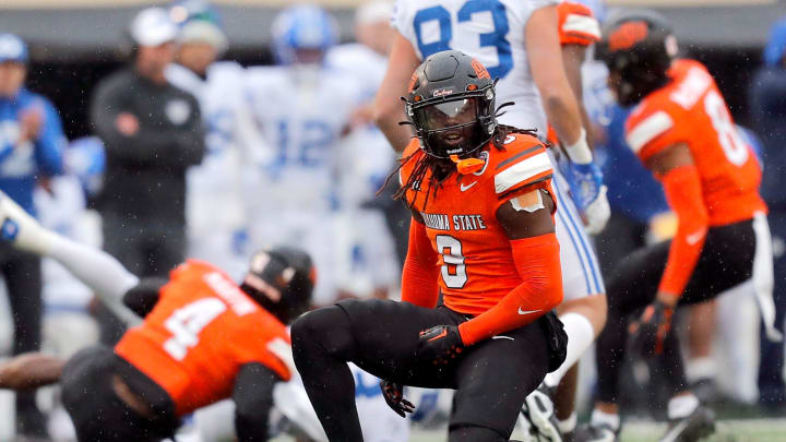 Oklahoma State's Trey Rucker (9) celebrates a play in the first half of the college football game between the Oklahoma State University Cowboys and the Brigham Young Cougars at Boone Pickens Stadium in Stillwater, Okla., Saturday, Nov. 25, 2023.